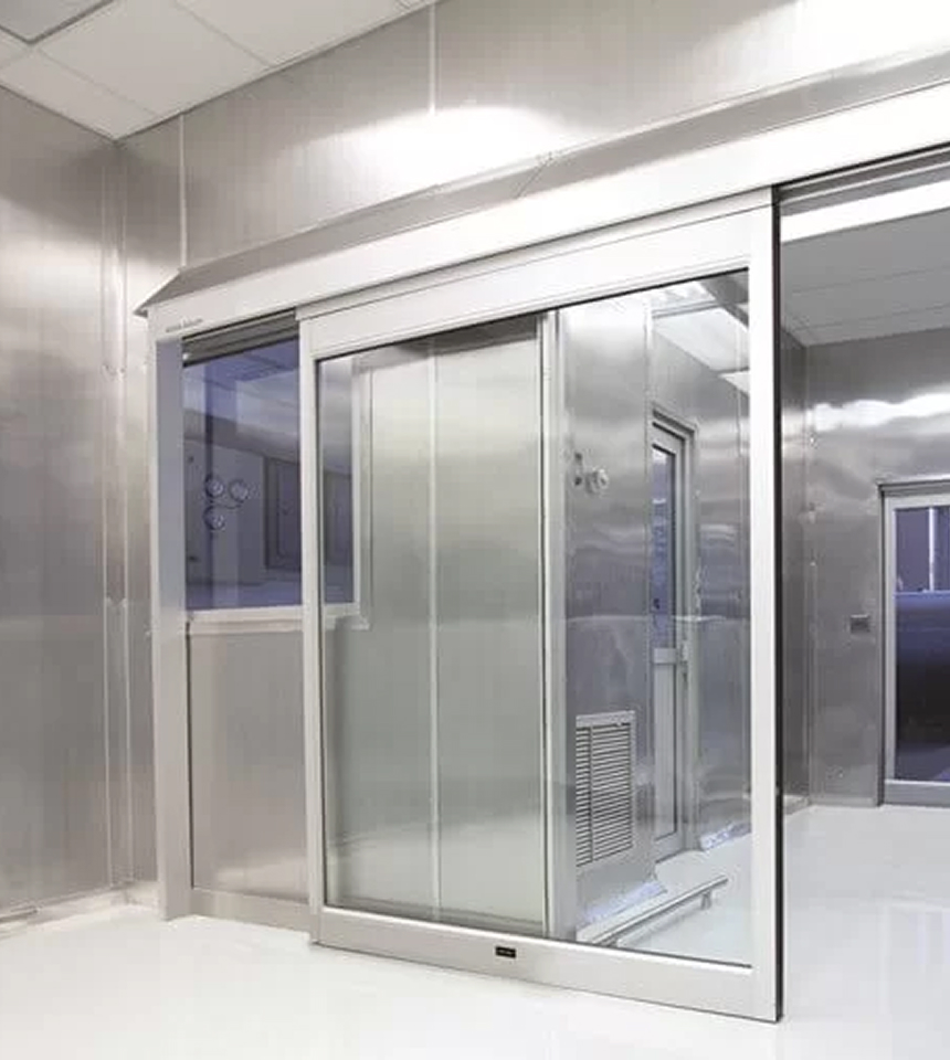 Man Using Measuring Tape in Factory Setting Man Using Measuring Tape in Factory Setting