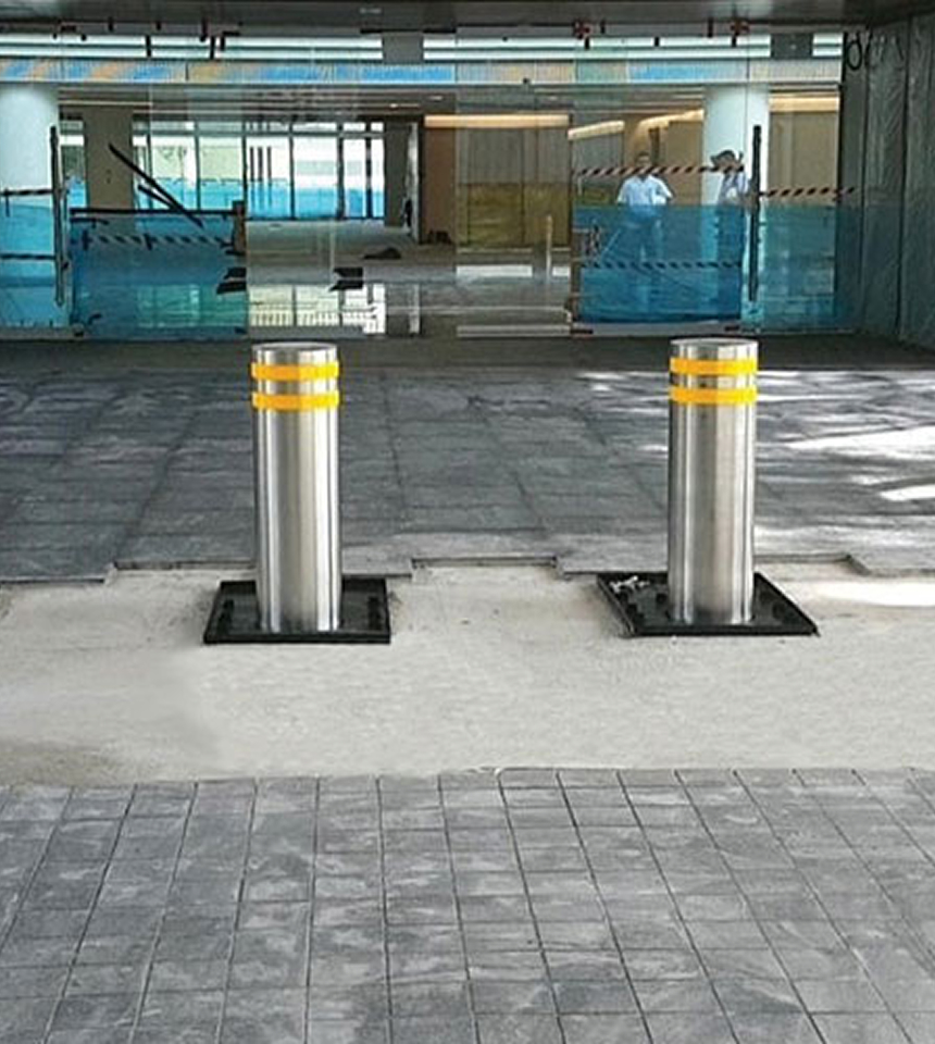 Man Using Measuring Tape in Factory Setting Man Using Measuring Tape in Factory Setting