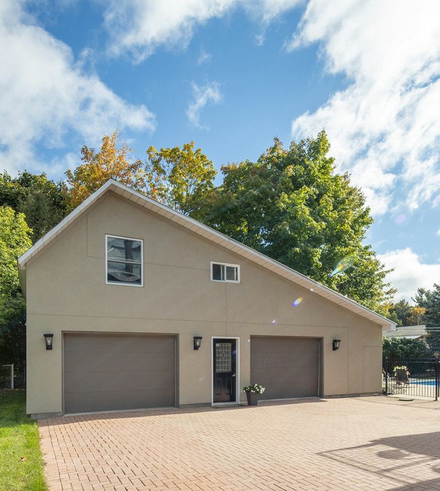 Man Using Measuring Tape in Factory Setting Man Using Measuring Tape in Factory Setting