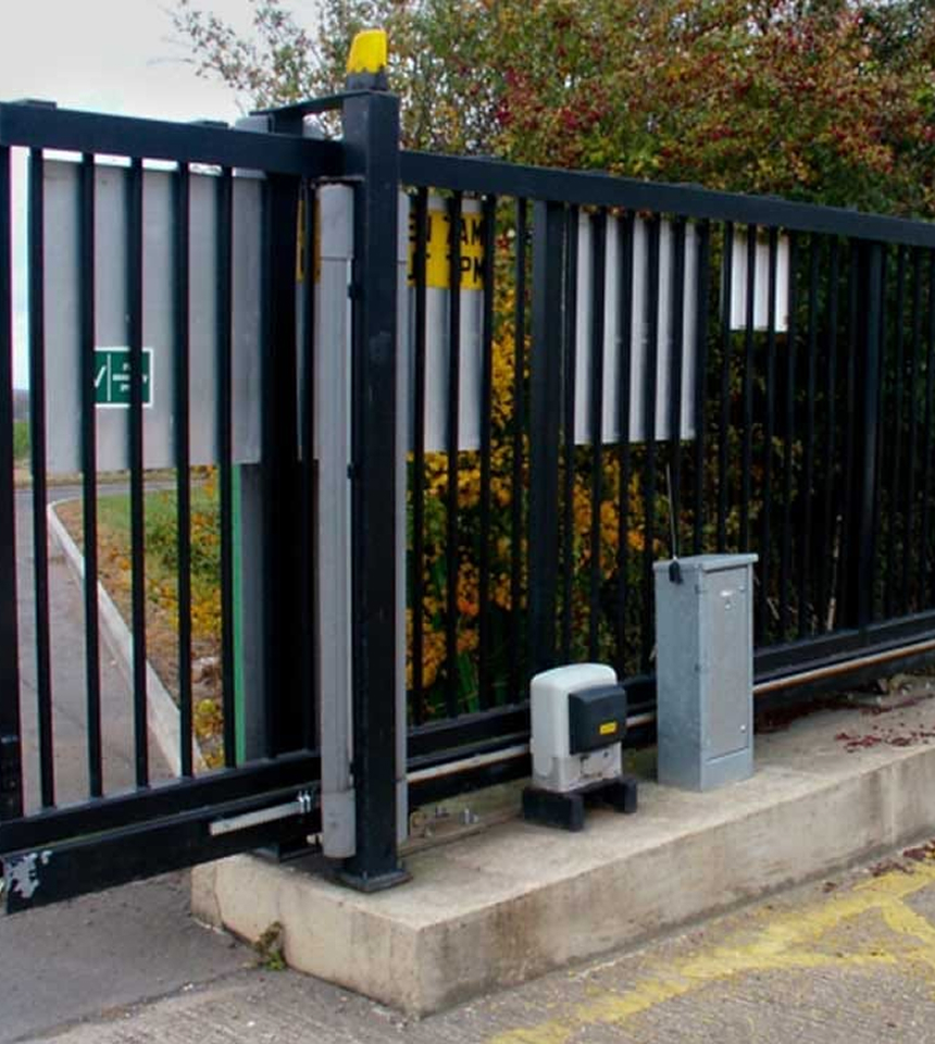 Man Using Measuring Tape in Factory Setting Man Using Measuring Tape in Factory Setting